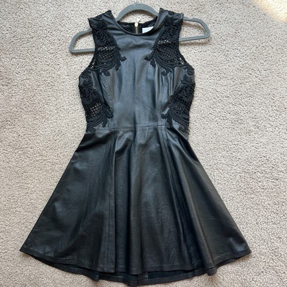 Black Genuine Leather Fit n Fare Mini Dress Lace Applique Exposed Gold Zipper XS - Picture 1 of 13